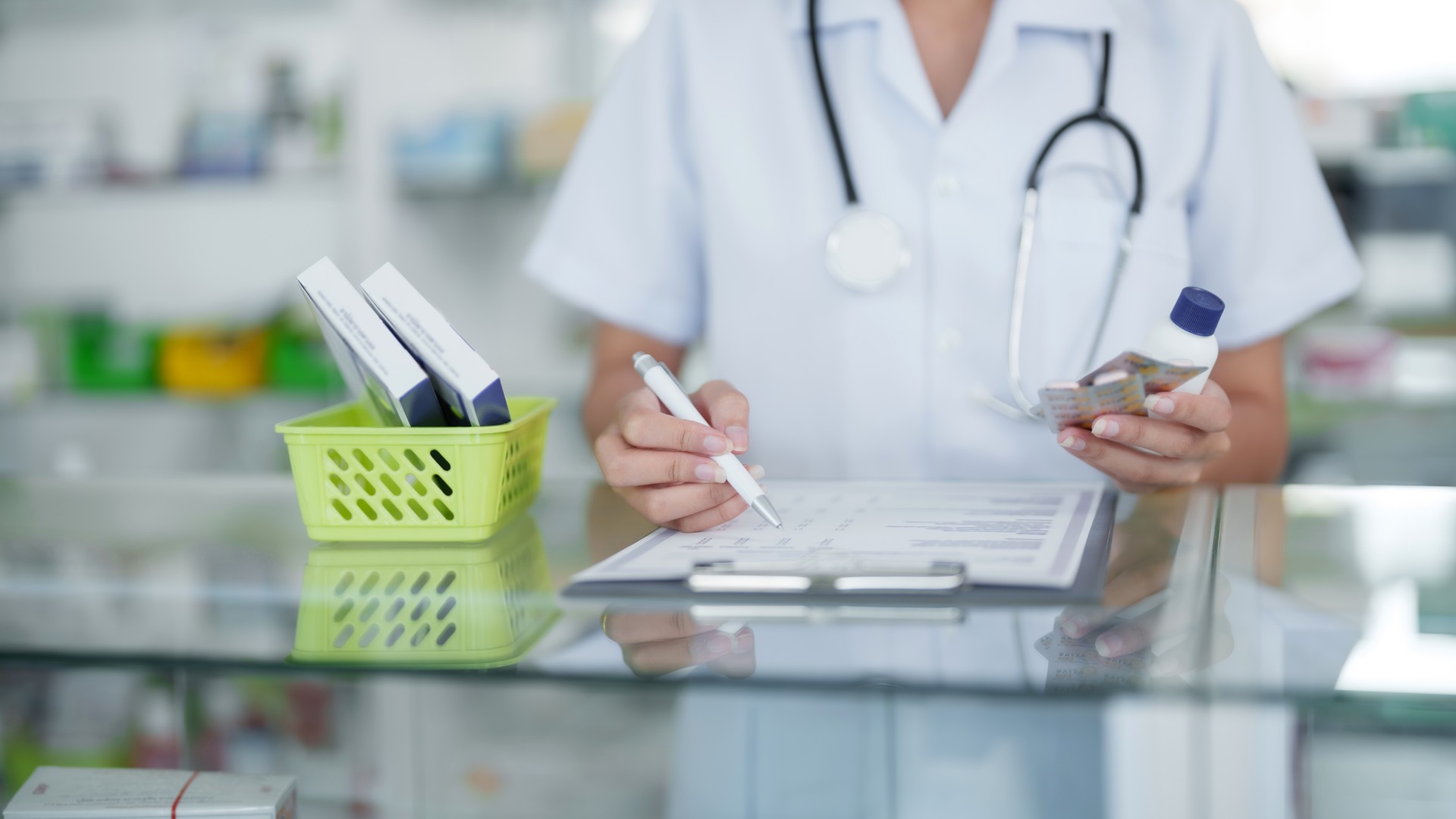 Asian woman pharmacist working at Pharmacy DrugstoreÂ . Medical healthcare concept